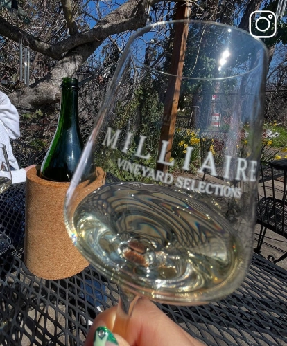 a glass of Milliaire wine